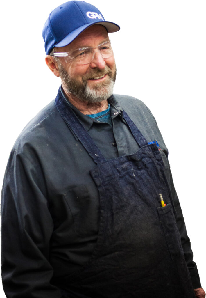 A GPM employee smiling on a white background.